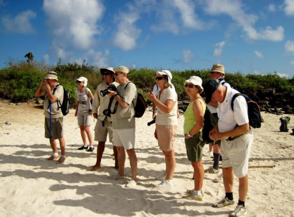 Guests taking photos while exploring the Galapagos Islands.